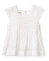 A light, effortlessly cute butterfly sleeve dress adorned with rolled seams along the top, lace trim and a ruffled skirt.