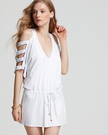 Play peek-a-boo with this v neck cover up from PilyQ. With a drop waist and dramatic detailing, this dress shows just enough skin to get you noticed.