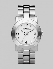 Stainless steel case and bracelet with a polished finish and clear stone hour markers.Quartz movement Water resistant to 3 ATM Stainless steel bezel with engraved logo Round case, 36mm, (1.43) White dial Numeral and clear stone hour makers Second hand Stainless steel bracelet, 20mm, (.79) Imported 