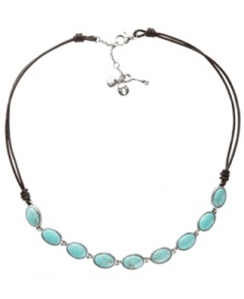 For the free-spirited fashionista, Fossil's trendy station necklace combines oval-shaped reconstituted turquoise stones set in vintage silver tone mixed metal and strung from a chocolate leather cord. Features a lobster claw closure. Approximate length: 17 inches + 2-inch extender.