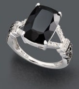 Make a bold style statement with chic, contrasting colors. Ring highlights a rectangular onyx stone (13 mm x 9 mm) with white diamond accents at the sides and round-cut black diamonds (1/8 ct. t.w.) at the band. Crafted in sterling silver. Size 7.