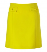 Defy the workweek style rut with this bold yellow A-line skirt from Tara Jarmon - A-line silhouette, front flap pockets with buttons, front and back seaming detail, concealed side zip closure - Wear with a printed silk top, a blazer, and ballet flats