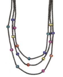 A colorful remix on a stylish classic. Nine West's three-row necklace combines multicolored plastic beads with a hematite-plated mixed metal setting. Approximate length: 18 inches. Approximate drop: 2 inches.