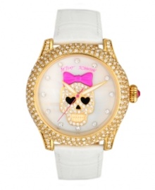 Cuteness to die for. Watch by Betsey Johnson crafted of white croc-embossed leather strap and round polished gold tone stainless steel case covered in crystal accents. White mother-of-pearl dial features crystal accent markers, large gold tone skull with pink bow and crystal accents at center, gold tone hour and minute hands, signature fuchsia second hand and logo. Quartz movement. Water resistant to 30 meters. Two-year limited warranty.