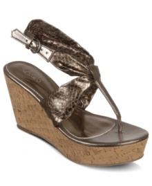 Shine bright in the sheen of these wedges. Carlos by Carlos Santana's Sun platform sandals feature a single metallic animal-print strap that wraps around the ankle and is topped with a cute side buckle.