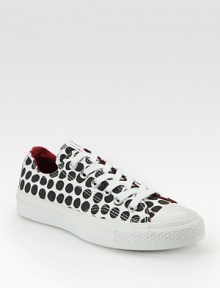 Traditional canvas staple with a bold polka-dot print and lace-up front. Canvas upperRubber solePadded insoleImported