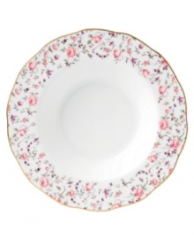 Scattered with dainty blooms, the Rose Confetti rim soup bowl restores the grace and charm of another era in fine bone china from Royal Albert. A scalloped edge with gold banding and a traditionally feminine palette add to its romantic sensibility.