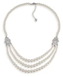 The classic elegance of pearls. Carolee's sophisticated three-row necklace features glass pearls accented by sparkling silver tone spacers with crystal accents. Set in imitation rhodium-plated mixed metal. Approximate length 20 inches + 2-inch extender.