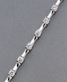 Utterly unique. Links of cylindrical platinum over sterling silver separate gleaming round-cut cubic zirconia (2-1/10 ct. t.w.) in this CRISLU bracelet. Approximate length: 7-1/2 inches.