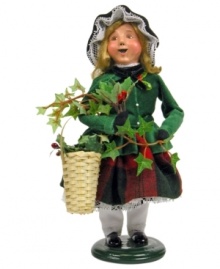 In the business of decking halls with boughs of holly, this young girl helps her mother sell the traditional red and green plants of Christmas. A beautiful figurine from the Cries of London collection, with the handcrafted charm of Byers' Choice.