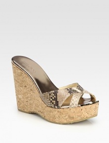 A cork wedge heightens this seasonal staple in rich snake-print leather for exotic appeal. Cork wedge, 4½ (115mm)Cork platform, 1¼ (30mm)Compares to a 3¼ heel (80mm)Snake-print leather upperLeather liningRubber solePadded insoleMade in Italy