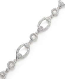 Chic and classic! Eliot Danori's link bracelet may be timeless and traditional, but sparkling crystals and glass accents give it a glamorous new look. Set in silver tone mixed metal. Approximate length: 7-1/4 inches.