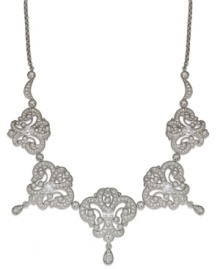 Be enraptured with Eliot Danori's elegant frontal necklace. Five ornate pendants shine with crystal accents and cubic zirconia stones (2-9/10 ct. t.w.). Crafted in silver tone rhodium-plated mixed metal. Approximate length: 16 inches + 2-inch extender. Approximate drop: 1/4 inch.