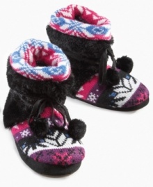 Fiesty fur at the ankles of these Kit booties from MUK LUKS adds a fierce accent to her looks.