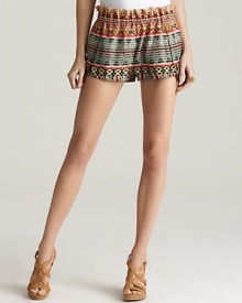 Take your look to new heights with Rebecca Minkoff tribal-print shorts. Playful and on-trend, the luxurious style goes from day-ready to evening-perfect with a swap of shoes and an armful of bangles.