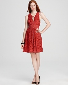 This French Connection dress has a keyhole at the neckline and a cut-out at the back, lending unique style to the playfully printed silhouette. Take the look from desk to dinner with a chunky bangle and glossy peep-toes.