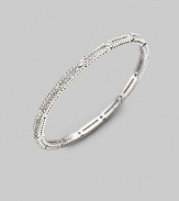 EXCLUSIVELY AT SAKS. A delicate design, offering two rows of small crystal solitaires with larger ones stationed along the slender bangle. Crystal Rhodium plated Diameter, about 2½ Hinged with push-lock clasp Imported Please note: Bracelets sold separately.