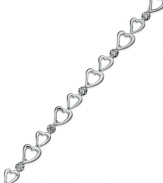 Follow your heart. Victoria Townsend's adorable bracelet features a row of open-cut hearts and shining diamond accents in sterling silver. Approximate length: 7 inches.