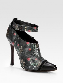 Luxe python takes on a flirty floral print in this ankle-strap silhouette, topped with a leather and suede point toe. Stacked heel, 4½ (115mm)Python upperLeather point toe with suede trimSide zip and adjustable ankle strapLeather lining and soleMade in ItalyThis style runs small. We recommend ordering one half size up for a standard fit. 