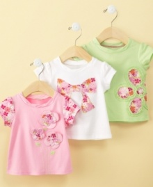 Frilly floral-patterned appliques add girlish appeal to this adorable shirt from First Impressions.