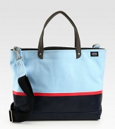 Tote your belongings around town in style this season with this structured canvas bag, dipped in rubber latex for added protection, in contrasting colors that lends a nautical feel to a contemporary design.Double top handlesAdjustable shoulder strapInterior zip pocketCanvas14W x 16H x 6DImported