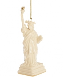 As statuesque as her inspiration, the Lady Liberty ornament welcomes guests to gather 'round. Her gold torch is radiant atop ivory porcelain with the esteemed craftsmanship of Lenox.