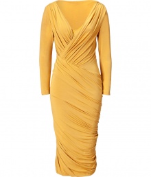 The ultimate figure-hugging dress, this draped Donna Karan favorite will have you turning heads while maintaining comfort - V-neckline with faux wrap detail, long sleeves, front and back twist drape detail, fitted pencil silhouette - Style with statement sandals, a draped front leather jacket, and a studded clutch