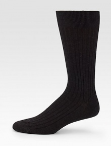 Sophisticated solid ribbed in remarkably soft, virgin merino wool.Mid-calf height80% wool/20% nylonMachine washMade in Italy