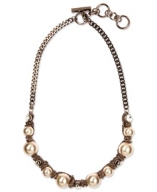 Givenchy's gorgeous necklace design combines imitation pearls and sparkling crystals in a stylish frontal setting. Crafted in brown gold tone mixed metal. Approximate length: 16 inches + 2-inch extender.