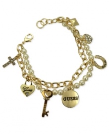 GUESS turns up the charm with this two-row bracelet. Crafted from gold-tone mixed metal, the bracelet features pieces adorned with glass pearls and crystal accents for a stylish effect. Item comes packaged in a signature GUESS Gift Box. Approximate length: 7-1/2 inches. Approximate diameter: 1-1/2 inches. Approximate drop: 1/2 inch.