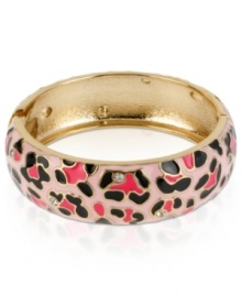 Heed the call of the wild with this hinged bangle bracelet from Betsey Johnson. Crafted from gold-tone mixed metal, a leopard print and glass crystal accents give this an edgy fashion infusion. Approximate diameter: 2-3/8 inches.