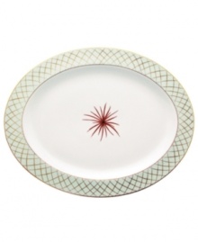 An intricate gold lattice pattern frames a single starburst in the center of this striking platter from Bernardaud.