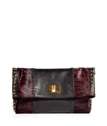 With leather and zebra-printed calf hair patchwork details and edgy stud embellishments, this Emilio Pucci clutch is a statement-maker - Leather and printed pony hair patchwork, front flap with logo turn-lock closure, studded side panels - Pair with leather leggings, an oversized blouse, and platforms