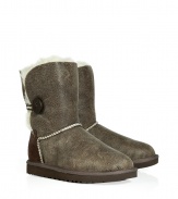 Stylishly distressed and undeniably cozy, these vintage-inspired shearling boots from UGG Australia lend comfort and style to your cold weather look - Round toe, rugged rubber sole, exposed seams, side button detail, contrasting back suede panel, cozy shearling lining, ankle-length , distressed leather - Pair with skinny jeans, an oversized cashmere sweater, and a down jacket or wool cape