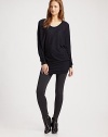 Slouchy scoopneck with long dolman sleeves hits below the hips, concluding with an alluring v-back. Ribbed scoopneckLong dolman sleevesRibbed cuffs and hemV-back40% rayon/30% nylon/25% polyester/5% cashmereDry cleanImported