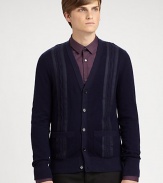 The classic V-neck cardigan updated with textural cable stripes, all in a fine cotton, cashmere & wool knit.V-neckButton frontLong sleevesPatch pocketsRibbed trim33% cotton/31% cashmere/24% woolDry cleanImported