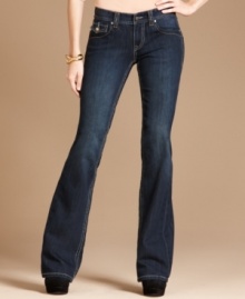 A pair of flared jeans gets glowing with the help of rhinestone buttons! INC's denim gives any outfit a glam touch!