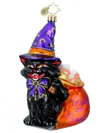 A ferocious black cat works magic on any home, turning cozy to creepy and warm to wicked. Fangs, crescent moons and a bag of too-good-to-be-true treats complete the festive Halloween decoration from Christopher Radko.