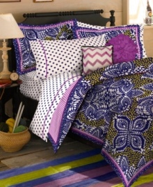 These Samara Batik decorative pillows from Teen Vogue wow you with artistic zigzags and perfect petals in pretty purple hues for a whimsical look.