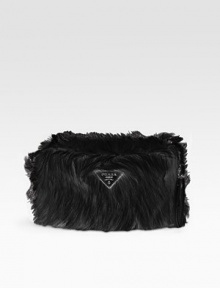 Lush faux fur makes this slim bag an instant statement-maker.Wristlet strap, 5½-6 drop Top zip closure Signature jacquard lining 11W X 7H X 3½D Made in Italy