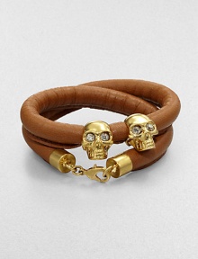 Two iconic, crystal accented skull beads on a luxurious, wrapped leather cord. Leather cordGoldtone brassCrystalsLength, about 14Lobster clasp closureMade in Italy