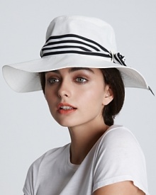 Ahoy mate, check out this stylish nautical-inspired sun hat with a contrast striped chiffon band from Eugenia Kim.