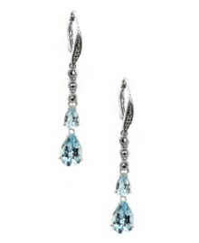 Take your special occasion style to a whole new level. Judith Jack's stunning drop earrings feature two pear-cut blue topaz (3-5/8 ct. t.w.) and glittering marcasite (1/5 ct. t.w.). Set in sterling silver. Approximate drop: 1-3/4 inches.