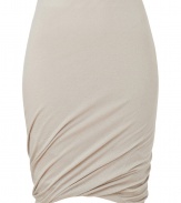 Sumptuously soft and effortlessly elegant, Donna Karans pure, beige cashmere knit skirt epitomizes understated luxury - Curve-hugging, medium-rise pull on style with hidden elasticated waist - Gorgeous signature drape and twist detail at hem - A chic go-to in any wardrobe perfect for pairing with cashmere pullovers, silk tops or button downs and ankle booties or platform pumps