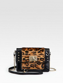 This miniature design combines smooth leather with leopard-print calf hair and gleaming hardware for a luxurious effect. Detachable chain and leather shoulder strap, 22½ dropFlap closure with turn-lockOne inside zip pocketOne inside open pocketEight credit card slotsCotton lining7¾W X 5H X 1DImported