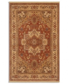 Intricately designed in the classic Serapi-style of Persia with a striking center medallion, this rug is painstakingly crafted to capture the abrash or stria effect often associate with aged vegetable dyes. After weaving, each rug is given a special antique wash to further harmonize the colors with a rich vintage patina.