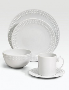 An elegantly detailed charger is made entirely by hand in fine Limoges porcelain with a raised pearl border. From the Perlee White Collection Porcelain 12½ diam. Dishwasher safe Imported 