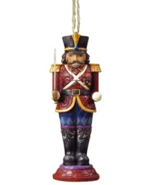 Standing guard at your tree, the Nutcracker soldier ornament is an instant holiday classic. Elaborate carved and patterned detail give him the traditional charm of Jim Shore.