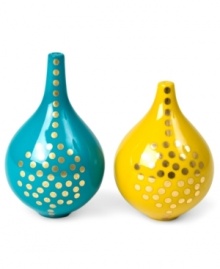 Improve the view with Jonathan Adler salt and pepper shakers inspired by the Greek island of Santorini and crafted of glazed porcelain with shimmering dots of gold.