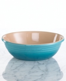 Cook and serve, all in one dish. Crafted for durability and ease of use but with a distinct ringed design and brilliant enamel finish to redefine a table, the large oval serving bowl from Le Creuset's serveware and serving dishes collection lends smart, enduring style to everyday dining.